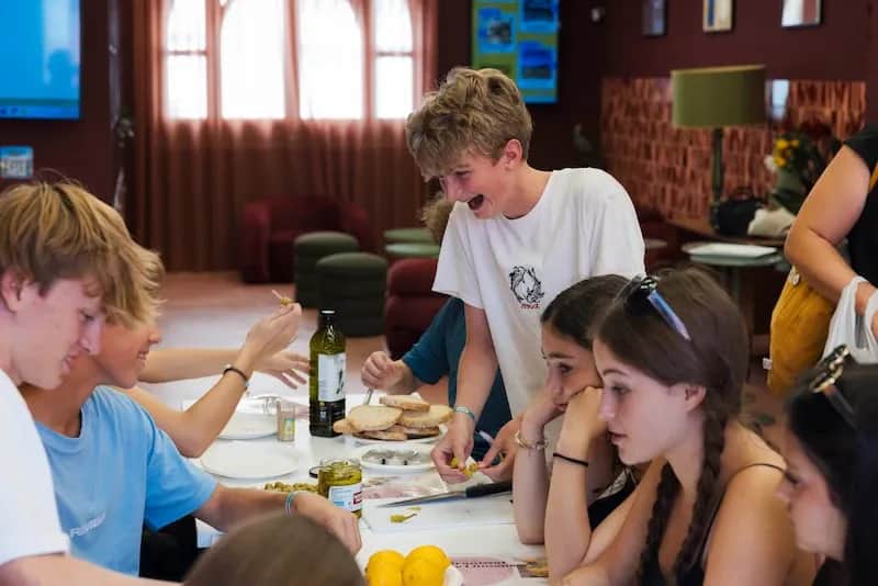 Expanish Barcelona summer camp students participating in a hands-on activity at school.