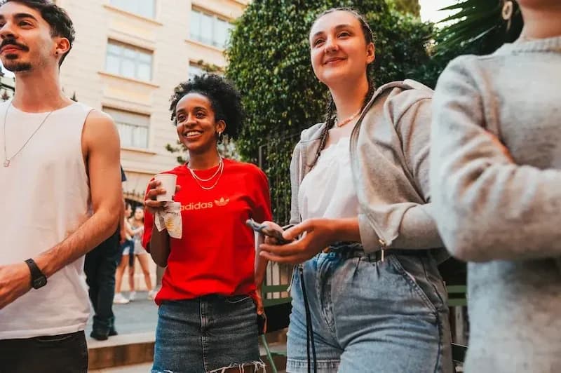 Students relaxing and talking in the common area of the Expanish Barcelona school.